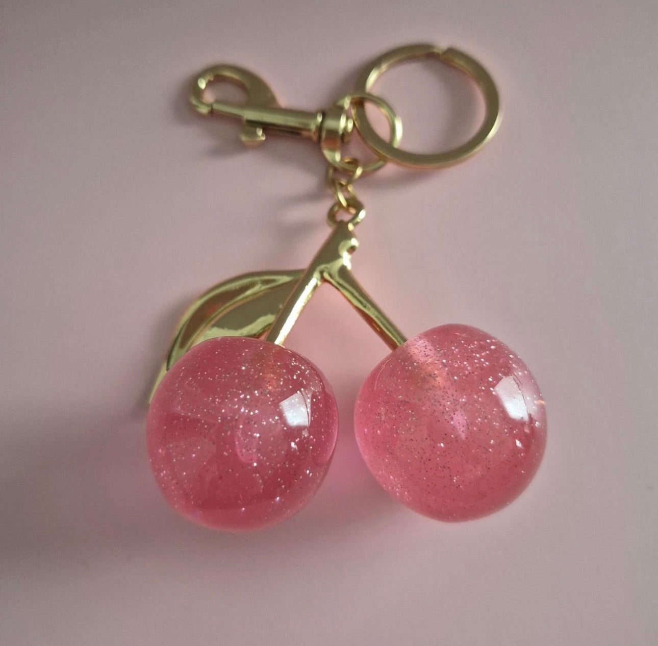Buy one get the other FREE  Cherry Charm Keychain 🍒✨ the other color is pink or color red this one in the picture is cherry red  you buy one get one free !!!