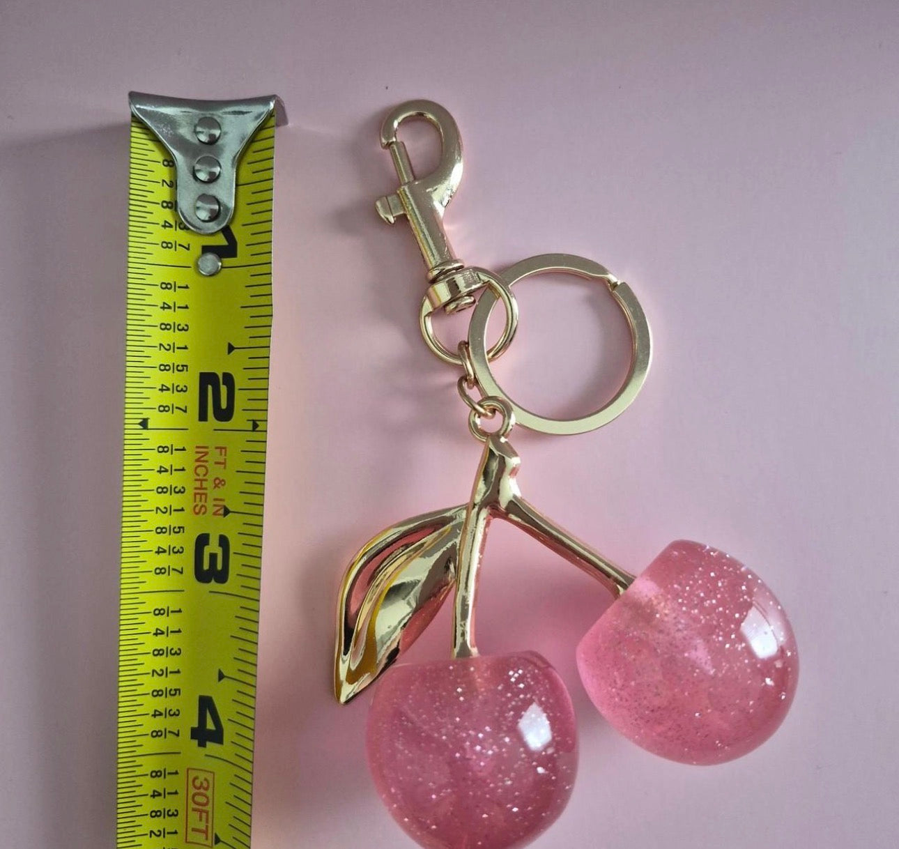 Buy one get the other FREE  Cherry Charm Keychain 🍒✨ the other color is pink or color red this one in the picture is cherry red  you buy one get one free !!!