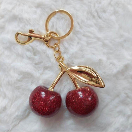 Buy one get the other FREE  Cherry Charm Keychain 🍒✨ the other color is pink or color red this one in the picture is cherry red  you buy one get one free !!!